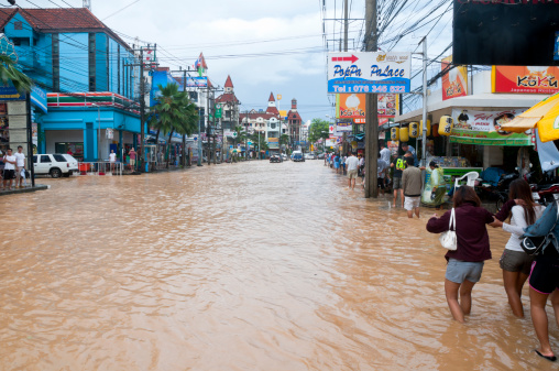 Patong, Phuket, Thailand - September, 5 2008: Floods on Thanon Ratuthit Songroipi road in Patong, Phuket. Flooding is very common during the wet season in Phuket as storm drains struggle to cope with the heavy tropical down pours