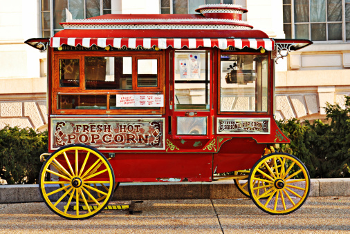 Washington, DC, USA - March 23, 2008: The ornate red antique Popcorn Wagon is a fixture in front of Smithsonian musuems on the Mall in Washington DC.