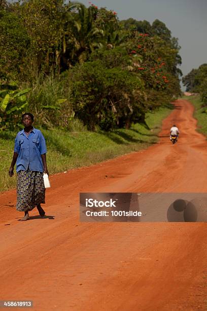 Proud African Woman Walking On The Village Road Stock Photo - Download Image Now - Adult, Africa, African Ethnicity