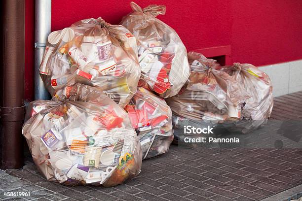 Garbage In Plastic Bags At A Mcdonalds Stock Photo - Download Image Now - McDonald's, Architectural Feature, Consumerism