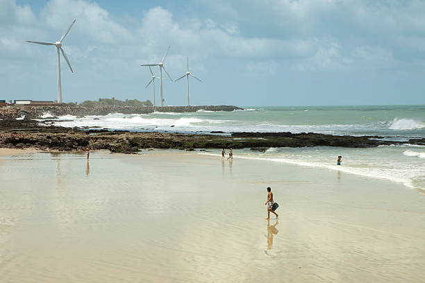 Fortaleza, Brazil - November 14, 2011: Wind Turbines and people at the beach of Fortaleza, Ceara, Brazil