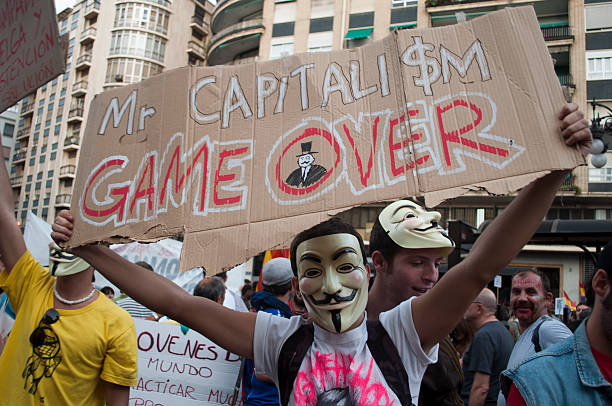 Mr. Capitalism game over Valencia, Spain - October 15, 2011: Demonstration in the Valencia streets, under the slogan \"United for a global change\", to protest against government policies to combat the crisis. sabotage stock pictures, royalty-free photos & images