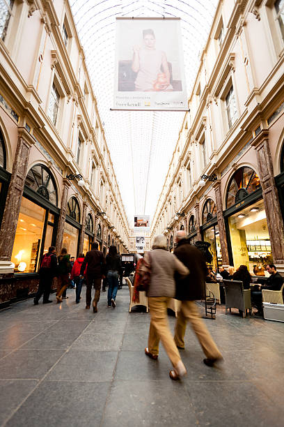 Galleries of the Queen in Brussels Brussels, Belgium - November 4, 2011: People walking by in Galeries de la Reine shopping centre in Brussels, Belgium. galeries de la reine stock pictures, royalty-free photos & images