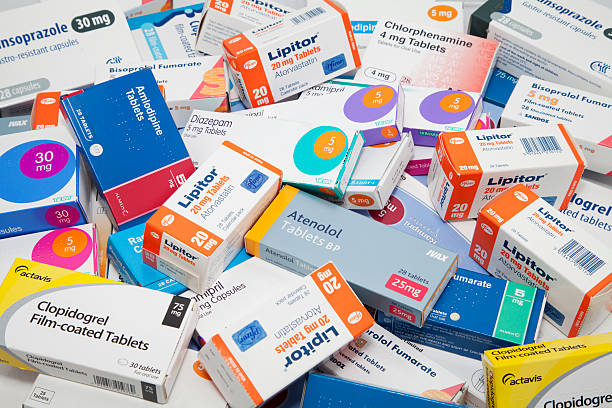 Prescription Drug Background Aberdeen, Scotland - October 1, 2011: A collection of various boxes of prescription drugs including diazepam, statins, beta blockers and various others. statin photos stock pictures, royalty-free photos & images