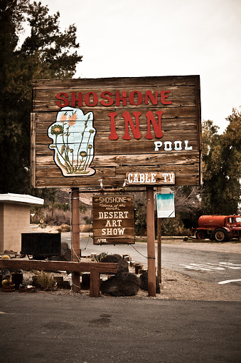Shoshone, California, USA - March, 19 2009: wooden sign of the Shoshone Inn located at the border with the Death Valley in California.