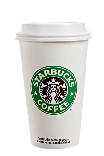 Chico, California, USA - February 27,2011 : A Starbucks paper cup with lid. Seattle based Starbucks operates a worldwide chain of over 15,000 coffee houses.