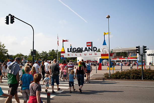 Legoland Billund, Denmark - August, 02th 2011: The Legoland entrance in Billund, Denmark. People crossing a road to get in. billund stock pictures, royalty-free photos & images