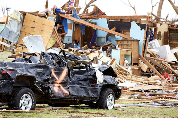 Joplin Missouri deadly F5 Tornado debris scattered Joplin, United States - May 25, 2011: Joplin Missouri deadly F5 Tornado debris scattered and auto in foreground only a few days following the storm deconstruct stock pictures, royalty-free photos & images