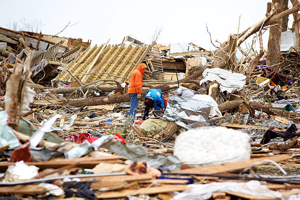 Joplin Missouri deadly F5 Tornado debris scattered Joplin, United States - May 25, 2011: Joplin Missouri deadly F5 Tornado debris scattered with people looking for personal items only a few days following the storm deconstruct stock pictures, royalty-free photos & images
