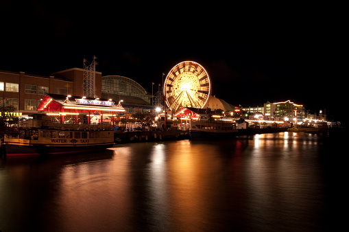 Chicago, USA – September 6th 2011: Chicago’s famous Navy Pier with colorful reflecting lights off the great lake. 