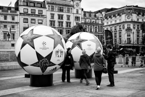 London, England - May 27, 2011: A promotional event for football's UEFA Champions League in Trafalgar Square, London in May 2011. The giant footballs attracted crowds of intrigued tourists - and their cameras. Trafalgar Square is the usual centre of England's celebratory events and all sorts of other activities.