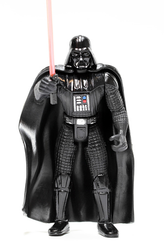 Vancouver, Canada - May 15, 2011: An action figure of the Star Wars character Darth Vader, from the Hasbro line of Star Wars toys, posed on a white background.