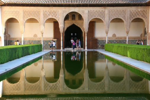 Granada, Spain-September 4th, 2010: beautiful garden with water pool in Alhambra, medieval Moorish palace and fortress in Granada