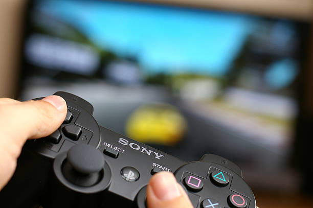 Gaming On Playstation 3 Stock Photo - Download Image Now