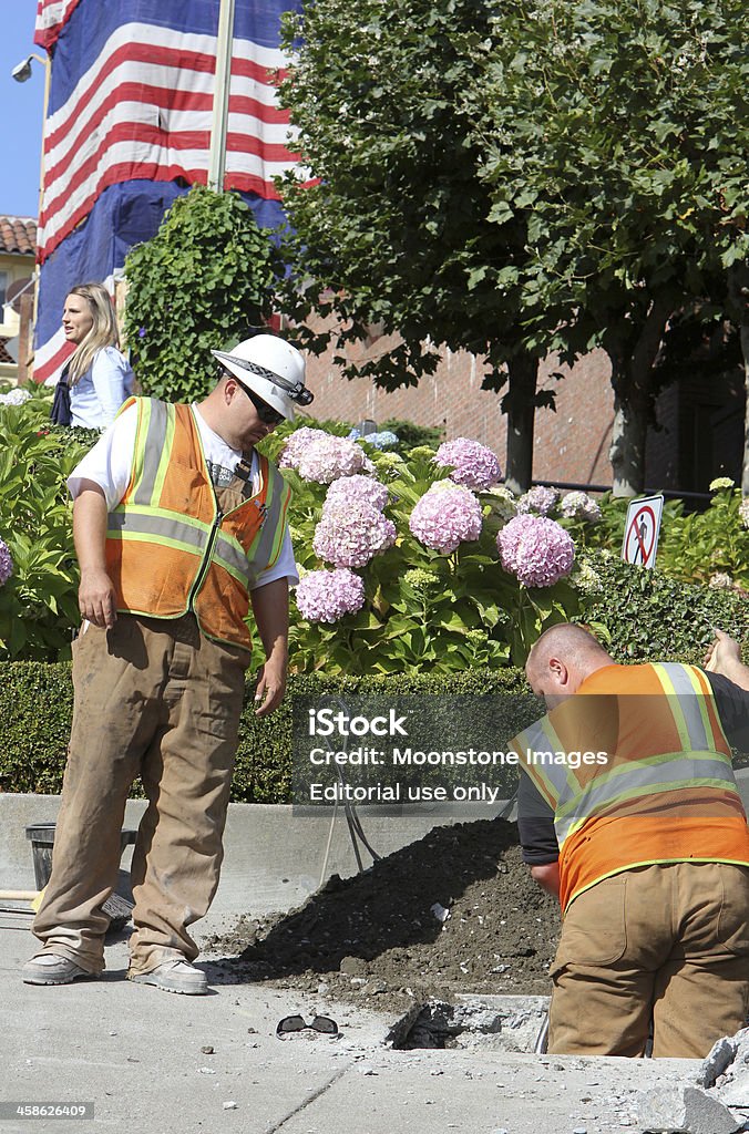Lombard Street in San Francisco, California San Francisco, United States - October 5, 2011: Two men perform maintenance on Lombard Street, a popular tourist attraction in San Francisco Adult Stock Photo