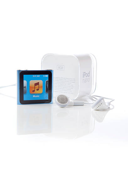 6th Generation Apple iPod Nano Portland, Oregon, USA - October 10, 2011: 6th Generation Apple iPod Nano with Multi-Touch technology shown with earbuds and the original packaging for this portable music player. ipod nano stock pictures, royalty-free photos & images