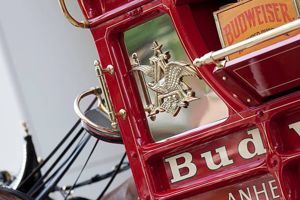 St. Louis, Missouri, USA - July 2, 2011: Side view of a traditional beer wagon used by Anheuser-Busch as seen prior to the start of the 2011 Fourth of July parade in downtown St. Louis, Missouri. Both the Anheuser-Busch logo and Budweiser brand name are clearly visible.  Anheuser-Busch is a wholly owner subsidiary of Anheuser-Busch InBev.