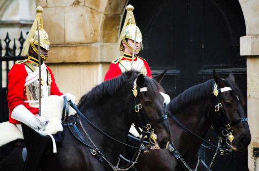 The Hague, The Netherlands - May 24, 2023; royal coachmen at a ceremony in front of Noordeinde Palace on Wednesday mornings when new ambassadors visit King Willem-Alexander and offer him their letter of credence. The audience includes a ceremony that can be followed from Noordeinde street. The ambassadors arrive by state coach, escorted by horsemen from the Royal Netherlands Mounted Police.