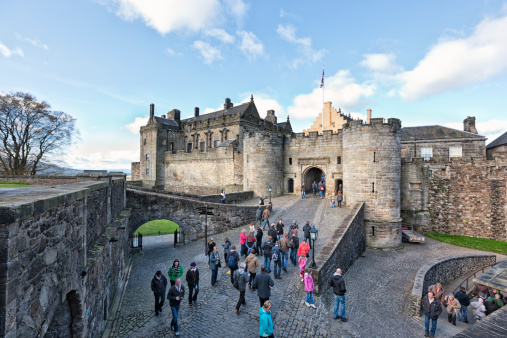 Stirling, UK - October 19, 2011: Tourists in the courtyard before the entrance to the heart of Stirling Castle.