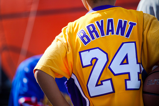 Halifax, Nova Scotia, Canada - September 10, 2011: A young Kobe Bryant fan waits to get an autograph from a basketball player at the NBA Jam Session Canada during its stop in Halifax, Nova Scotia.