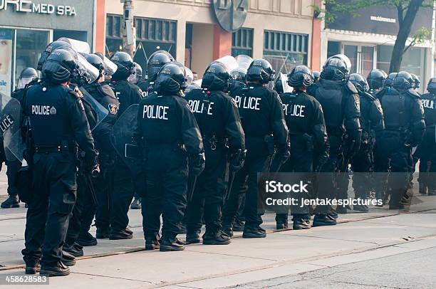 Row Of Police Officers Stock Photo - Download Image Now - Aggression, Police Force, Adult