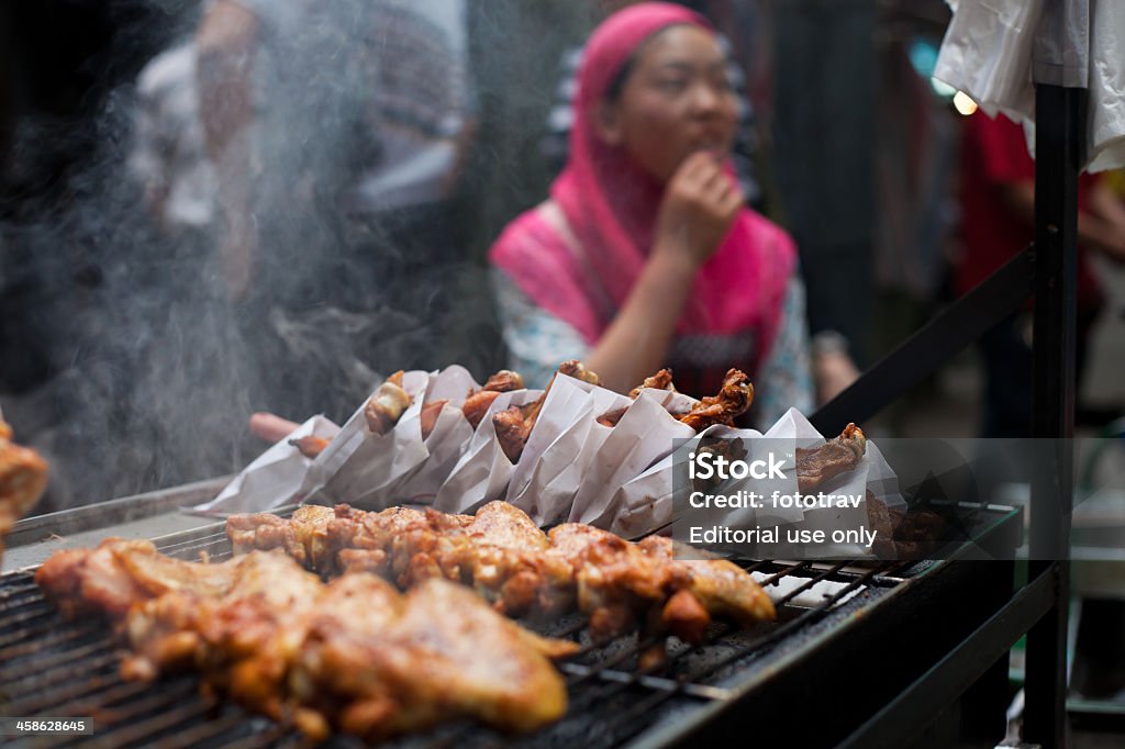 Chinese street comidas en el vecindario musulmana de Xi'An, China - Foto de stock de Adolescente libre de derechos