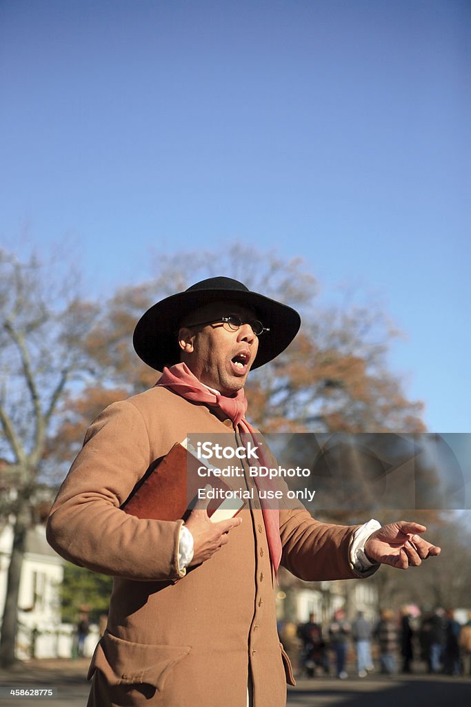 Colonial Preacher in Williamsburg, VA "Williamsburg, Virginia - November 14, 2008:  An actor playing the role of \""Gowan Pamphlet\"" and enslaved black man in Colonial Williamsburg, Va. who later in life was given his freedom and became a preacher.  This actor is \""in character\"" and is prepared to discuss life in Williamsburg, during the 1700\'s." Colonial Style Stock Photo