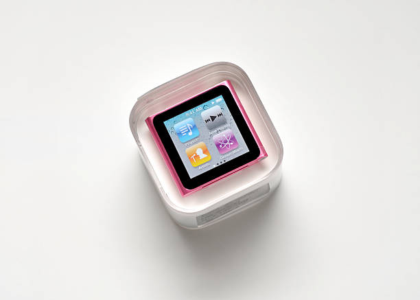 iPod Nano Vancouver, Canada -- January 11, 2011: Close up of a new iPod Nano by Apple Inc. in packaging on a white background with shadows ipod nano stock pictures, royalty-free photos & images