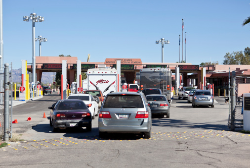 Lukeville, United States - November 27, 2011: Cars in line at the border crossing to cross from Mexico into the United States. The border is in Lukeville, Arizona a small town which revolves around just the border crossing and a few shops.