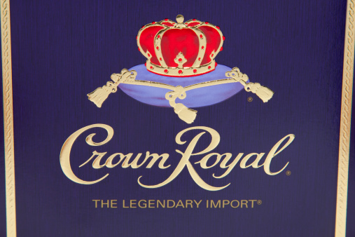 Nashville, Tennessee, USA - December, 23rd 2011: The front of the iconic purple Crown Royal Whisky box, with the logo embossed in a reflective golden print and a red crown upon a pillow.