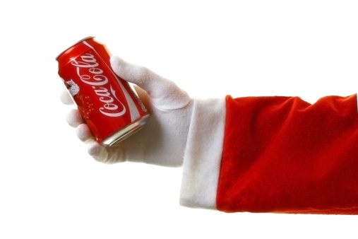 London, United Kingdom - December 12, 2011: Santa with Coca Cola. The coca cola company first used images of santa in 1930's Christmas advertising.