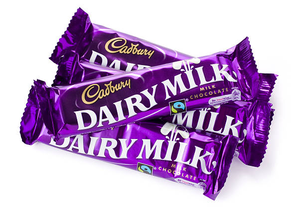 St Ives, England - August 15, 2011: Four 40g Cadbury Dairy Milk Chocolate Bars isolated on a white background.