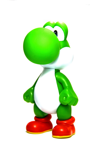 Vancouver, Canada - April 9, 2012: Yoshi from the Nintendo Super Mario franchise of games, posed against a white background. The toy is from Banpresto Company.