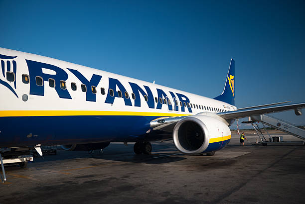 Pisa, Italy - August 6, 2009: Boeing 737-800 in the Pisa Galileo Galilei continental airport standing in the track before landing to the Malta Island . The airplane was Boeing 737-800 of RyanAir Company . The RyanAir is an airline operates flights to Europe city.
