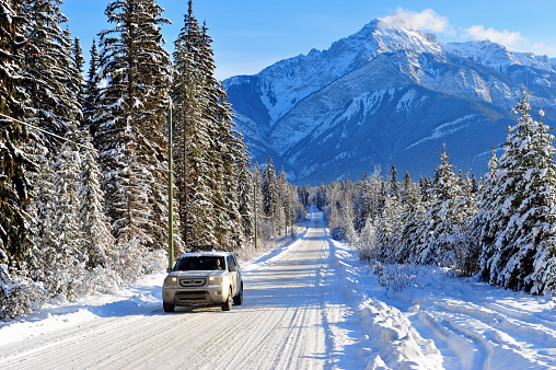 Golden, British Columbia, Canada - December, 30 th 2010: Family driving a 4WD Honda Pilot on a rural road in winter.