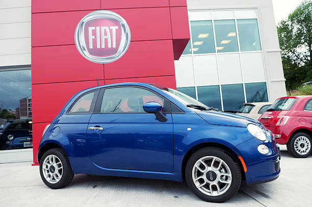 Fiat Dealer Halifax, Nova Scotia, Canada - July 9, 2011: New Fiat 500 Sport models at a Fiat dealer. The Fiat 500 or Fiat Nuova 500 is a city car built by Italian automaker Fiat since 2007. The car is currently produced in Tychy, Poland by Fiat Auto Poland S.A. and in Toluca, Mexico, by Chrysler Group LLC. little fiat car stock pictures, royalty-free photos & images