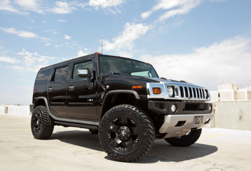 Scottsdale, Arizona, USA - June 28, 2011: A photo of a parked black Hummer H2. The H2 is the predecessor to the well known military used Hummer H1.