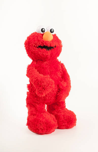 elmo plüschspielzeug stehen - sesame street fotos stock-fotos und bilder