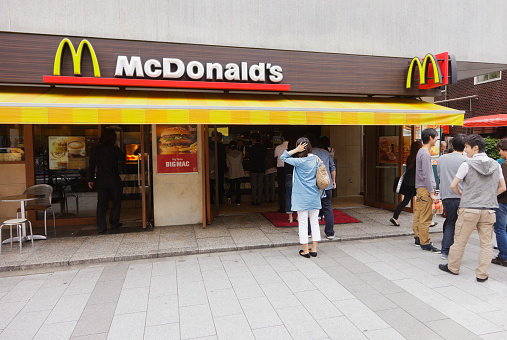 Tokyo, Japan - May 31, 2011: Customers line up to purchase food from a McDonald's restaurant in the Hamamatsucho business district of Minato Ward in Tokyo. McDonald's has over 3,500 locations in Japan.