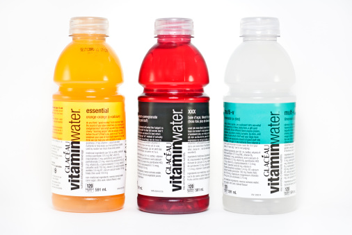 Vancouver, Canada - February, 10 2012: Three flavor of Glaceau enhanced water shot in studio against white background, GlacAau, is a privately owned subsidiary of Coca-Cola Company.