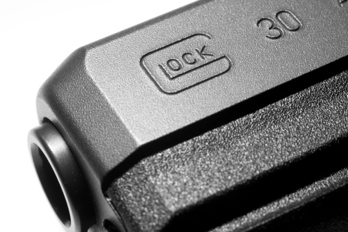 Carnation, WA, USA - January 29, 2012: Close-up view of the barrel and logo of a Glock 30SF .45 caliber semi-automatic handgun produced by GLOCK Ges.m.b.H.of Austria.