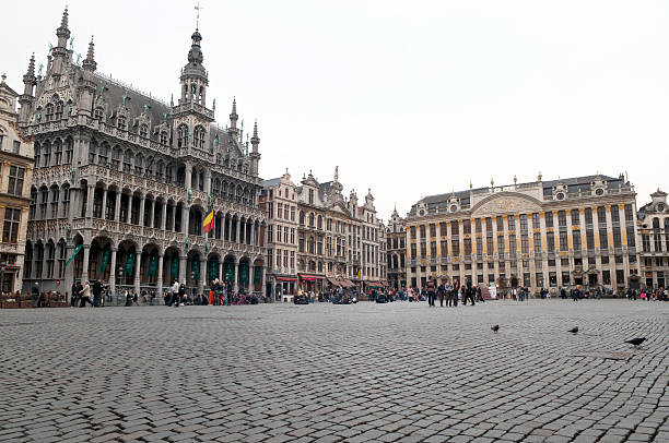 Grand Place in Brussels Belgium Brussels, Belgium - March 24th, 2010: People in the Grand Place, the main square in the cantre of Brussels; the Maison du Roi(King\'s House or Breadhouse) on the left. editorial architecture famous place local landmark stock pictures, royalty-free photos & images