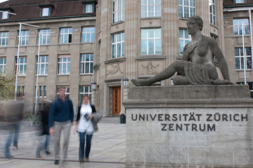 ZArich, Switzerland- April 19, 2012:Two students come, and two students go to UniveritAts center, the main entrance of the Swiss Federal Institute of Technology in Zurich.