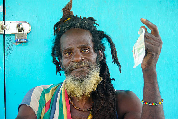 Havana, Cuba - July 15, 2024: Cuban people are by a broken and damaged building exterior. Lifestyle of real Cuban people.