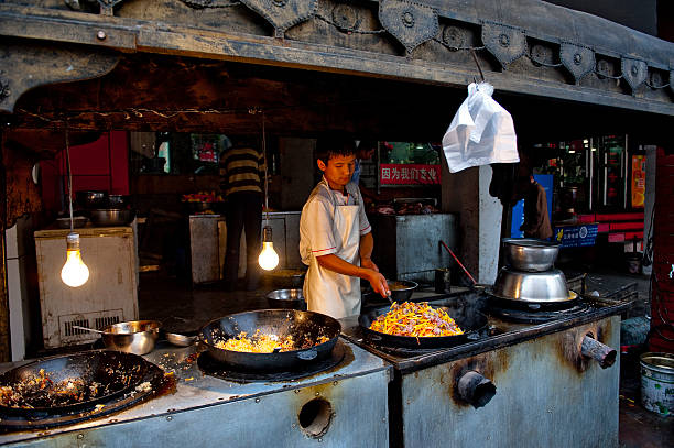food stand in the street of urumqi, china - urumqi stockfoto's en -beelden
