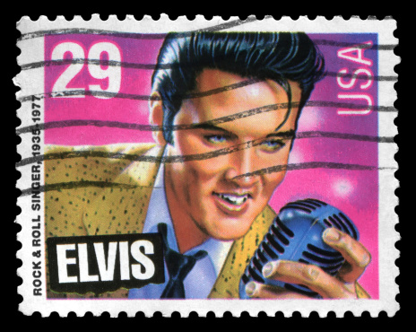 Beijing, China - January 31, 2012: US postage stamp:Rock & Roll singer Elvis Presley(1935-1977). He is often referred to as the \\\