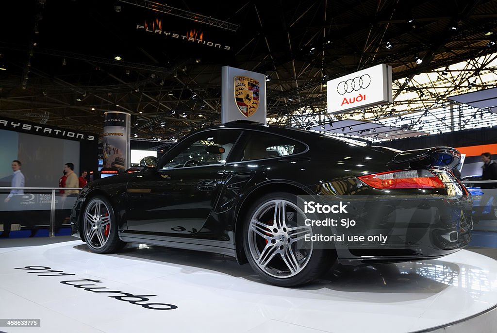 Porsche 911 Turbo Amsterdam, The Netherlands - March 27, 2007: Dark green Porsche 911 Turbo sports car on display at the Amsterdam Motor Show. People in the background are looking at the cars. Black Color Stock Photo