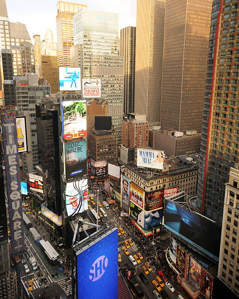 New York City's Times Square "New York, USA - December 30, 2011: Crowds begin to gather in New York City\'s Times Square in expectation of New Year\'s Eve" times square new years eve stock pictures, royalty-free photos & images
