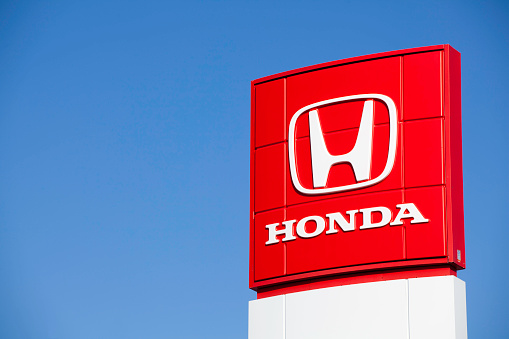 Dartmouth, Nova Scotia, Canada - March 13, 2011: A Honda Motor Company, Ltd. sign at a car dealership.  Founded in 1948 Honda Motor Company, Ltd. is best known for manufacturing automobiles and motorcycles.
