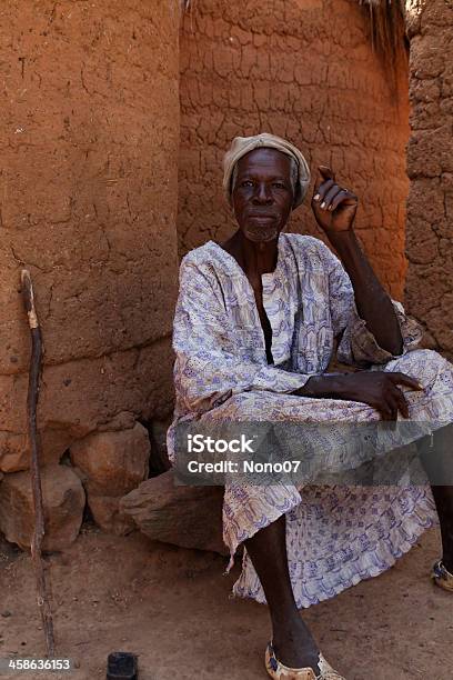 African Village Headman Resting In The Shade Of His Hut Stockfoto en meer beelden van Afrika